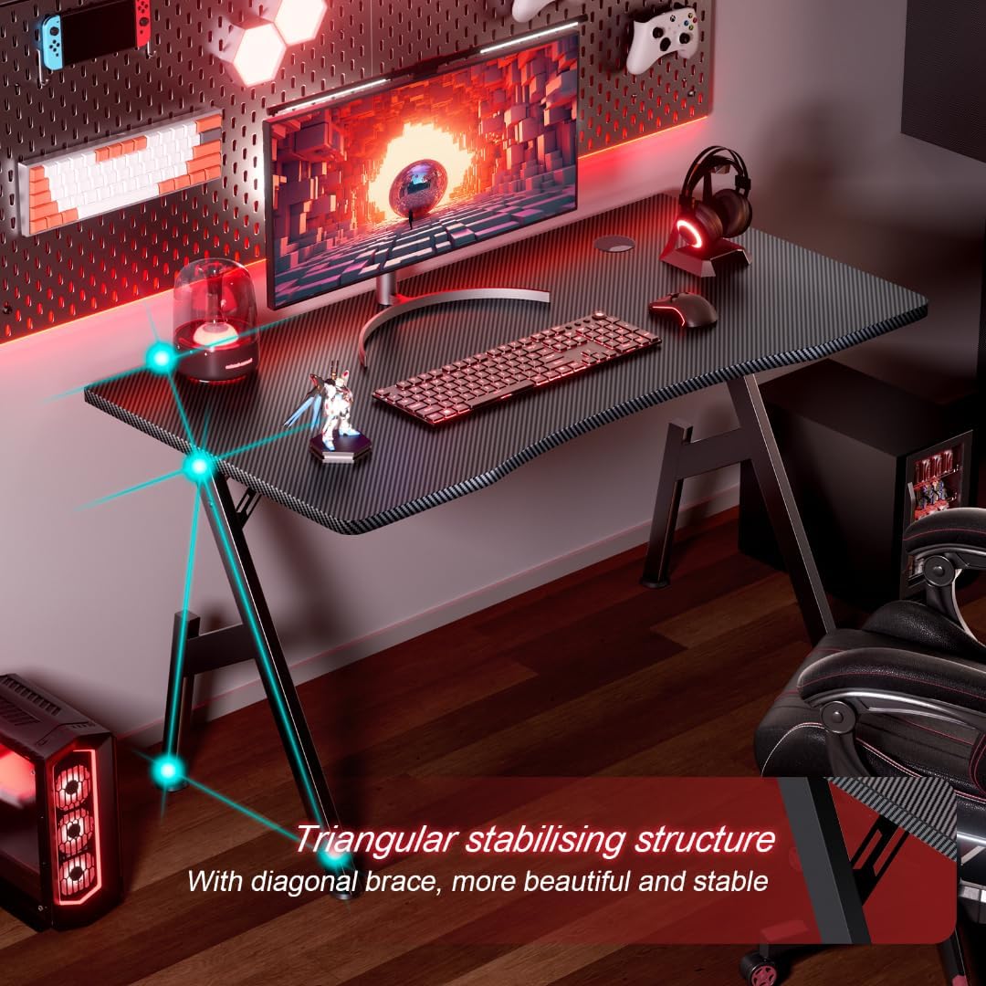Sturdy gaming desk in red-lit setup, emphasizing triangular stabilizing structure and diagonal support braces