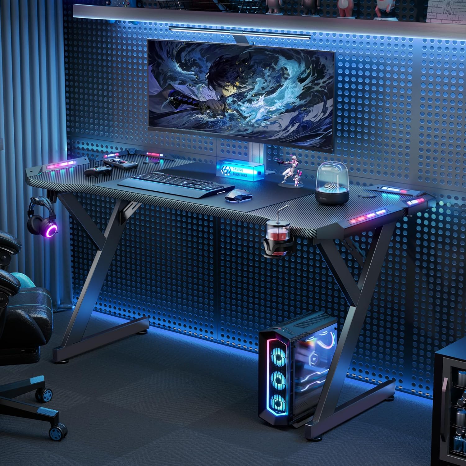 Full setup of gaming desk with blue lighting and gaming peripherals
